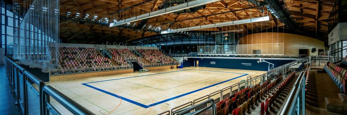 The main sports hall under its wooden roof